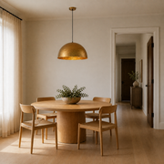 Scale | hammered gold dome pendant beside an open doorway