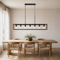 In a room | weathered-walnut 7-light chandelier hanging above a long dining table with woven-seat chairs