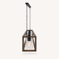 Profile | the chandelier tilted in studio light, showing the open-top cage and the row of glass cylinders and bulbs