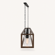 Profile | the chandelier tilted in studio light, showing the open-top cage and the row of glass cylinders and bulbs