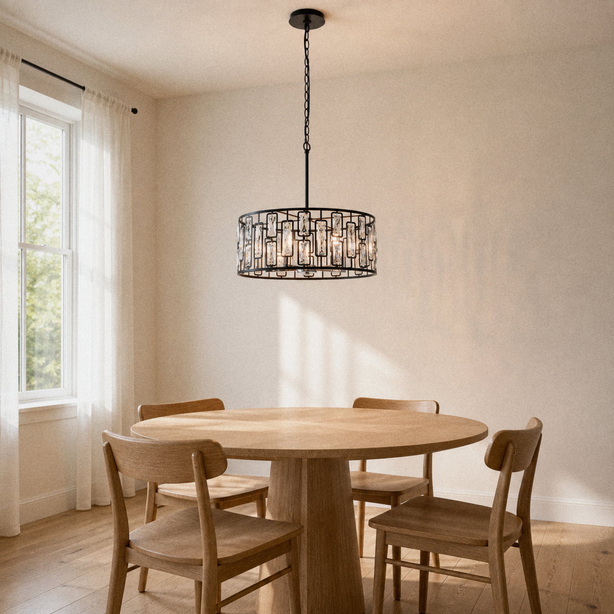 In a room | black crystal drum chandelier hanging over a round wood dining table