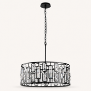 Front | studio front of the black metal drum and hanging crystal battens