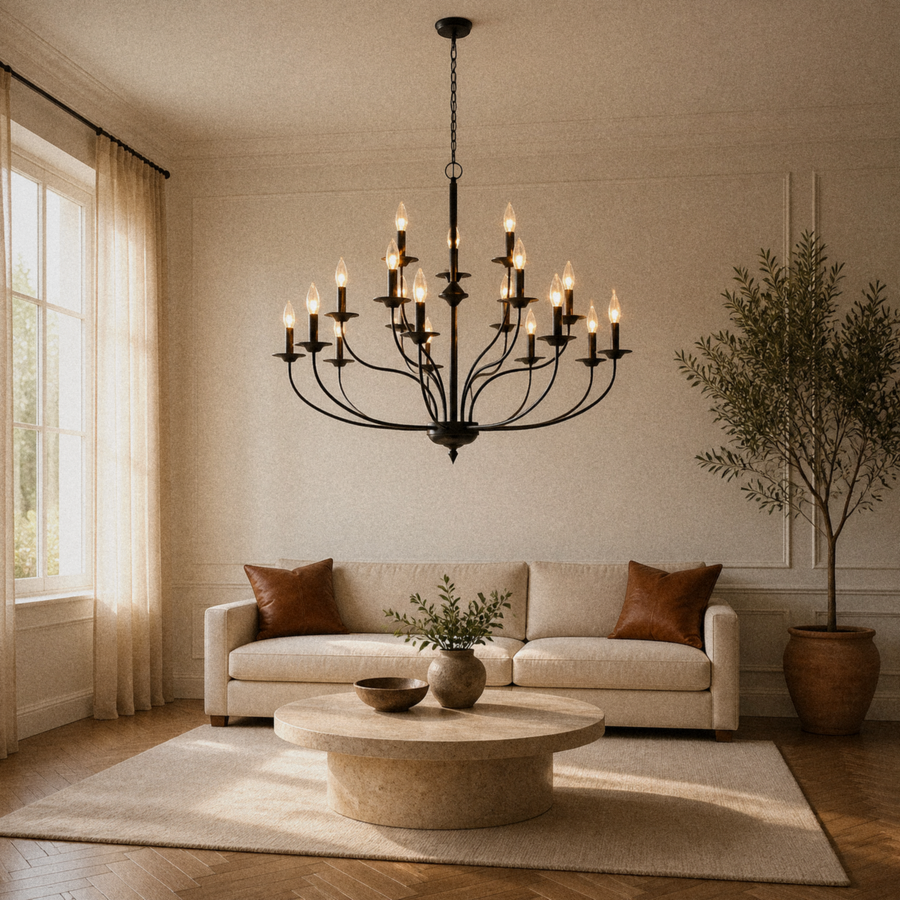 In a room | warm living room with a matte-black 18-light three-tier chandelier above a round travertine table and sofa