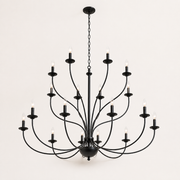 Side | low-angle studio view of a matte-black 18-light chandelier showing chain, canopy, curved arms, and lower finial