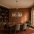 In a room | marnau Sein 5-Light Drum Chandelier over a dark-oak dining table in a terracotta library
