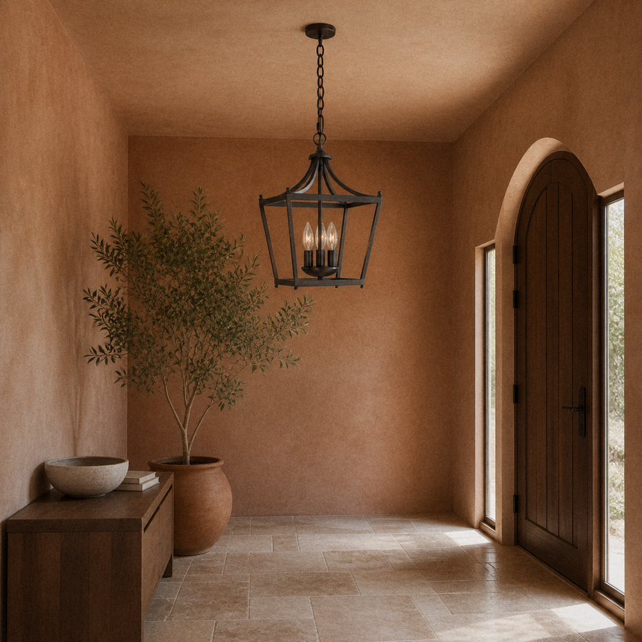 Entry hall | Burnished bronze open lantern pendant in a terracotta entry hall beside an arched doorway