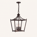 Front | Straight-on studio view of the chain-hung burnished bronze open lantern pendant with three candelabra sockets