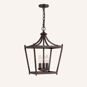 Front | Straight-on studio view of the chain-hung burnished bronze open lantern pendant with three candelabra sockets
