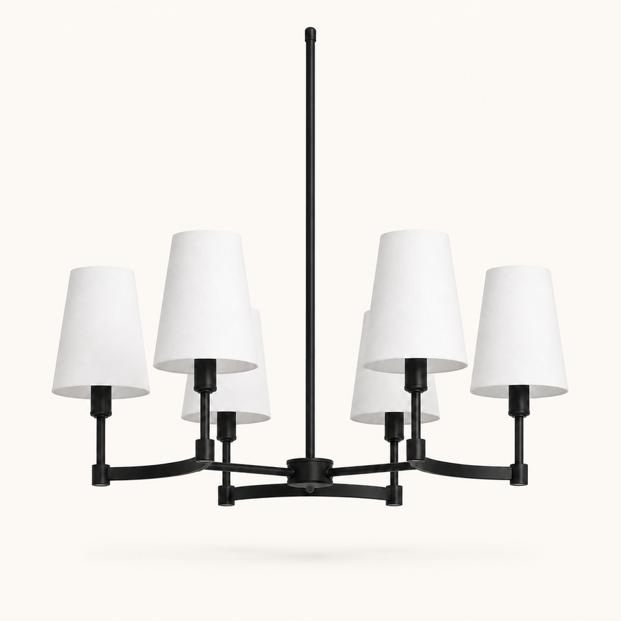Studio front | six-light chandelier with matte black arms, white fabric drum shades, canopy, and downrod