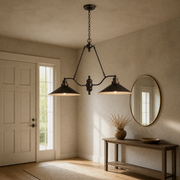 Entry | the same pendant hung above an entryway console table with a round mirror