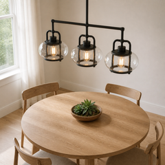 Marnau Tavenn 3-light island pendant in Old Bronze, dining angle