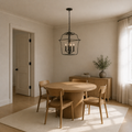 Scale | chandelier over a dining table beside an uncropped interior doorway
