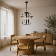 In a room | corner view of Royal Ebony lantern chandelier above round oak dining table