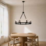 In a warm dining room | dark Classic Bronze 8-light wagon-wheel chandelier over a round oak table