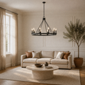 In a living room | dark Classic Bronze 8-light wagon-wheel chandelier over a round coffee table
