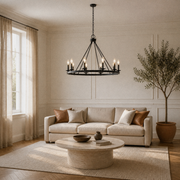 In a living room | dark Classic Bronze 8-light wagon-wheel chandelier over a round coffee table