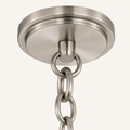 Hardware | close view of brushed nickel chain, connector ring, and round ceiling canopy