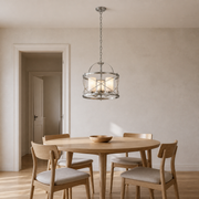 Scale | brushed nickel lantern chandelier beside an uncropped full-height doorway for scale