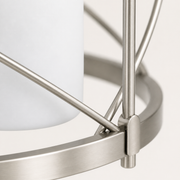 Texture | close view of brushed nickel steel X-brace, round rail, and frosted glass shade