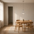 In scale | seeded glass pendant beside a full-height interior doorway