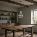 Blue-gray country kitchen | seeded glass pendant over an aged oak work table