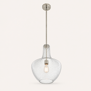 Studio angle | low three-quarter view into the open bottom of the seeded glass pendant