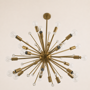 Side | worm's-eye studio view showing the chandelier underside, socket cups, crystal spheres, downrod, and canopy