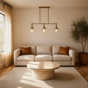 Living room | the pendant hanging above a sofa and round coffee table