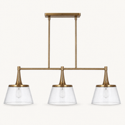 Front | studio front of the brass bar, two rods, and three seeded-glass cone shades