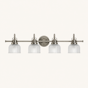Front | front studio view of antique-nickel 4-light vanity with four prismatic glass shades