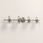 Studio | right three-quarter studio view of antique-nickel vanity, circular backplate, and four glass shades