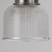 Texture | extreme close-up of a clear double-prismatic glass cylinder shade and antique-nickel collar