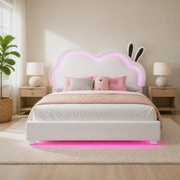Room view | White bed styled in a bright bedroom, viewed from the foot with the illuminated back as focal point.