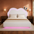 Room view | White bed against a warm wall with the cloud-shaped back, rabbit-ear accents, and illuminated outline visible.