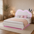 Angle | Three-quarter room view of the white bed, showing the low rails, white feet, and LED glow.