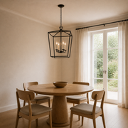 Scale | the chandelier hanging in the dining room beside a full-height window for size reference