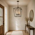 Entryway | the lantern chandelier hanging in a foyer beside a console table