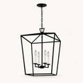 Front | studio front of the matte black lantern cage with four candle-style lights