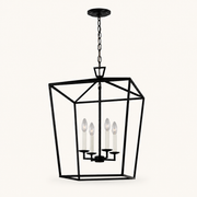 Front | studio front of the matte black lantern cage with four candle-style lights