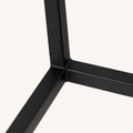 Detail | close view of the matte black cage bar finish and corner joint