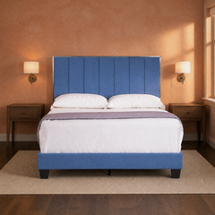 Room 3 | Front view of the upholstered bed against a warm clay wall with sconces, dark wood nightstands, and rug