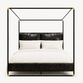 Front | Straight-on studio view of the black frame, gold-tone connectors, headboard, and footboard
