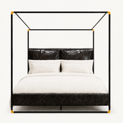 Front | Straight-on studio view of the black frame, gold-tone connectors, headboard, and footboard