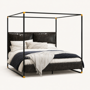 Studio | Three-quarter studio view showing the canopy rails, metal posts, and upholstered bed frame