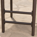 Hardware | close view of the wrapped footrest rails, legs, and dark round fasteners on a stool
