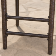 Hardware | close view of the wrapped footrest rails, legs, and dark round fasteners on a stool