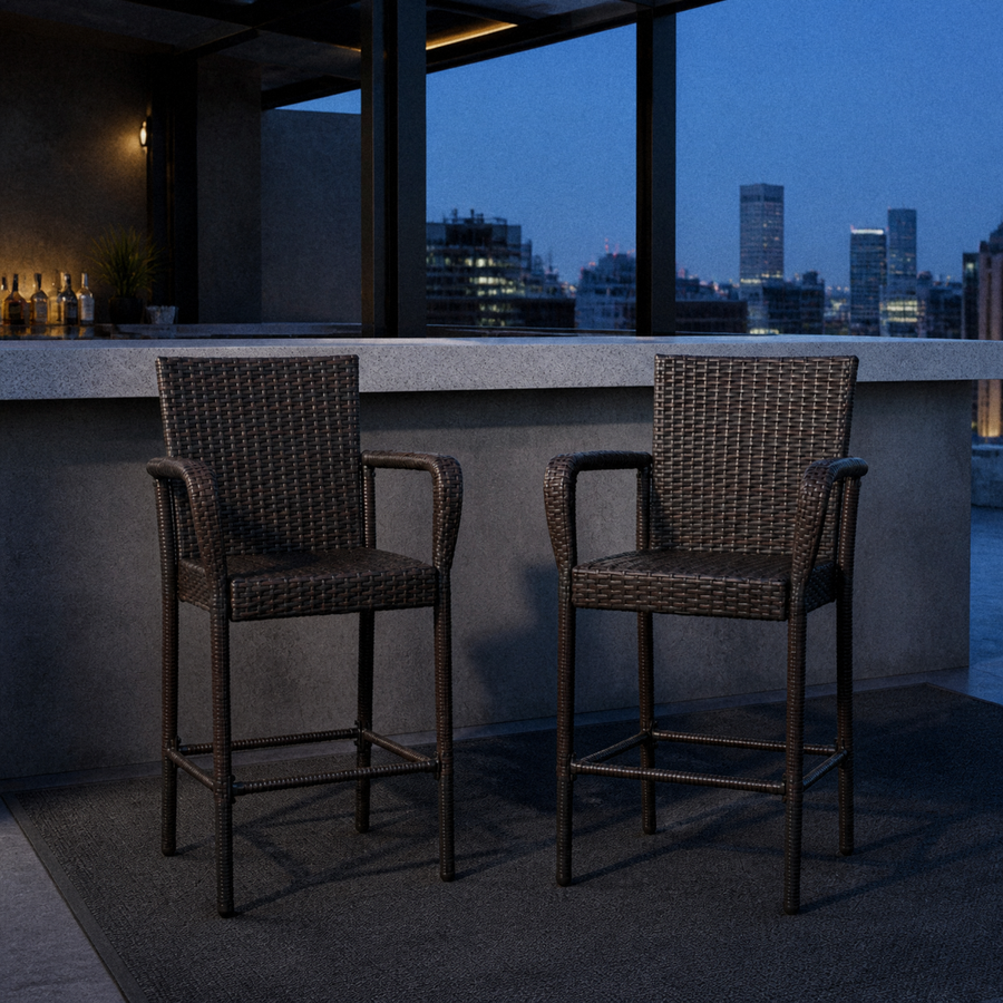 In a room | two dark brown woven wicker bar stools at a cool rooftop bar above a city skyline