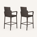 Side | rear-side studio profile of two dark brown woven wicker bar stools showing the backs, arms, and footrests