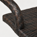 Texture | close view of the dark brown flat-strand wicker weave across a curved arm and seat edge
