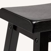 Texture | close-up on the saddle seat corner and Dark Espresso wood grain